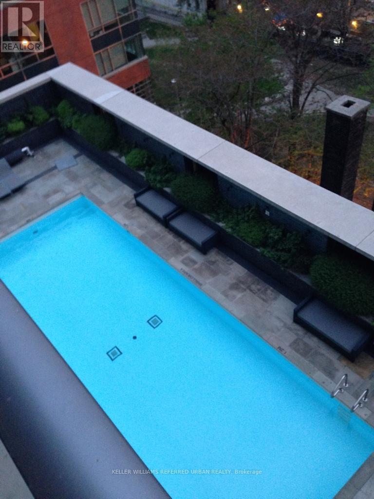 A small blue pool on a balcony.