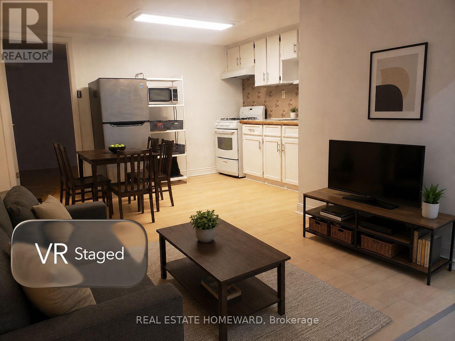 A living room with a VR Staged sign.