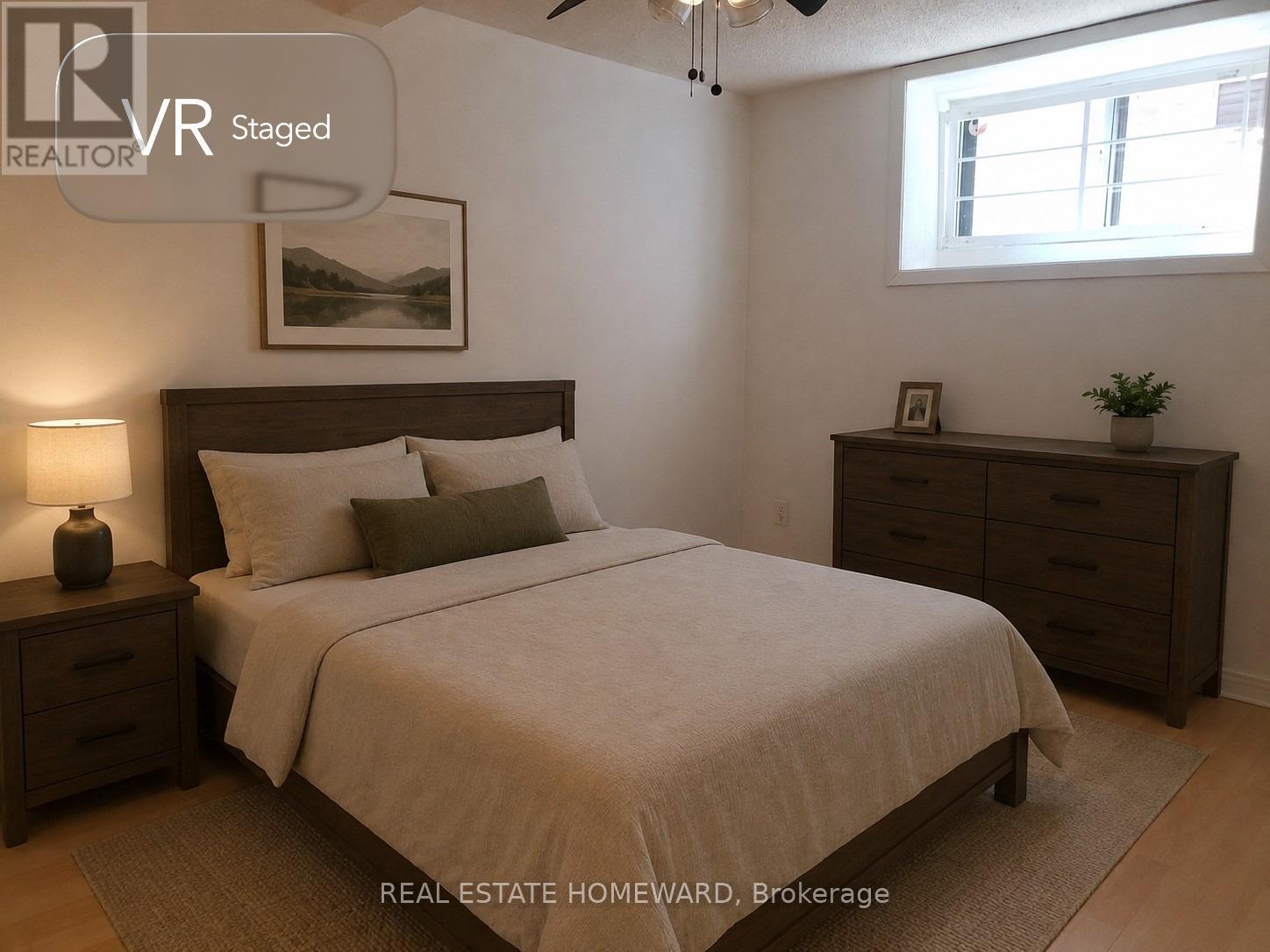 A bedroom with a bed, nightstand, and dresser.