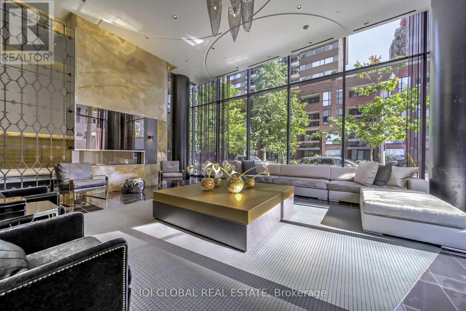 A modern living room with a large window and a view of the city.