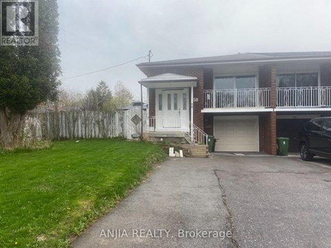 A house with a white door and a balcony is for sale.
