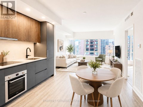 A modern kitchen with a dining table set for four.