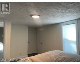 A room with a bed and a window.