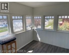 A room with a window seat and a view of the outside.