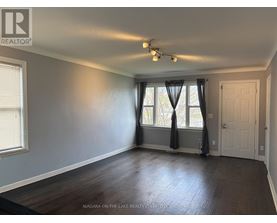 A room with a window and a door is for sale in Niagara-on-the-Lake.