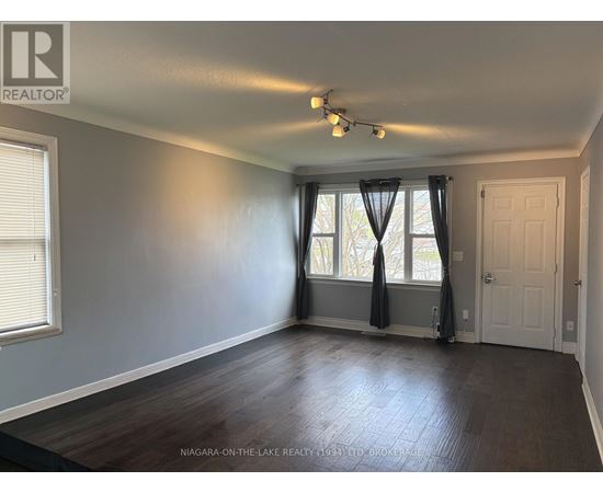 A room with a window and a door is for sale in Niagara-on-the-Lake.