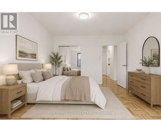 A bedroom with a large bed, nightstands, and a mirror.