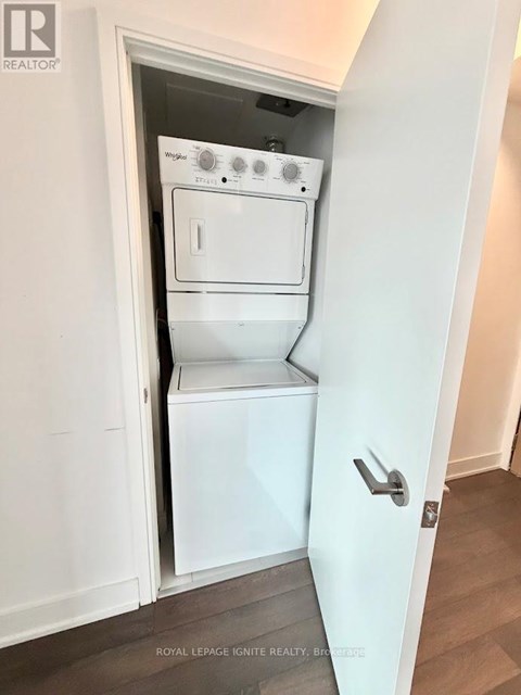 A white built in dishwasher and oven in a kitchen.