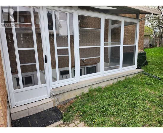 A white sliding door with a glass panel is closed.