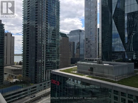 A cityscape with a building that has the letters "CBC" on it.