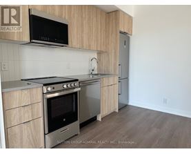 A kitchen with a stove top oven and microwave above it.