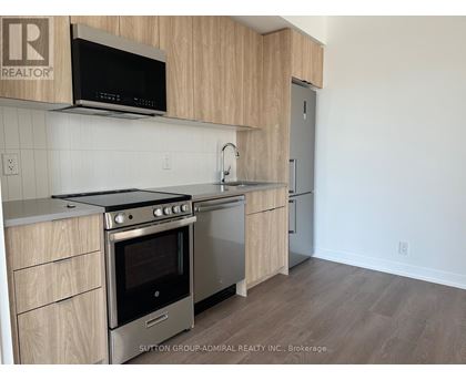 A kitchen with a stove top oven and microwave above it.