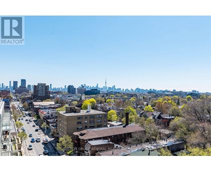 A cityscape with a clear blue sky and buildings of various heights.