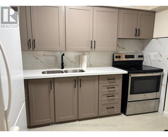 A kitchen with brown cabinets and a white countertop.