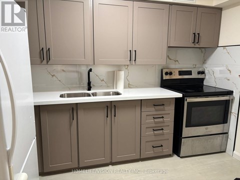 A kitchen with brown cabinets and a white countertop.