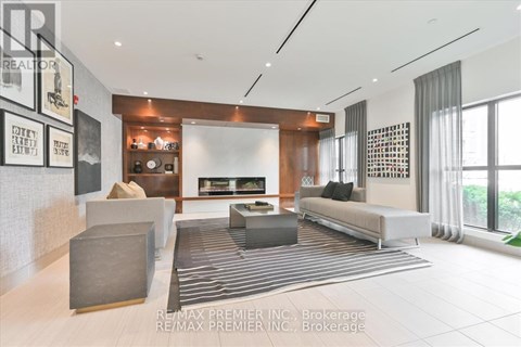 A living room with a grey sofa and a coffee table.