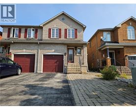 A house with a car parked in front of it.