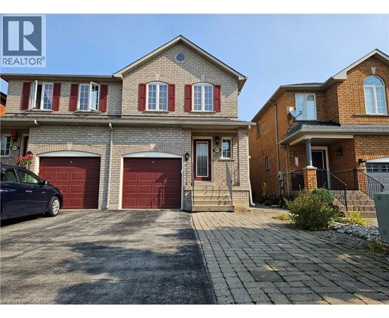 A house with a car parked in front of it.