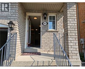 The front door of a building with a sign that reads "REALTOR".