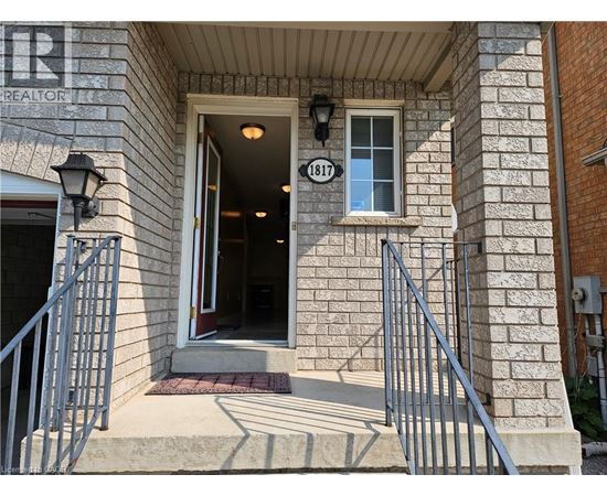 The front door of a building with a sign that reads "REALTOR".