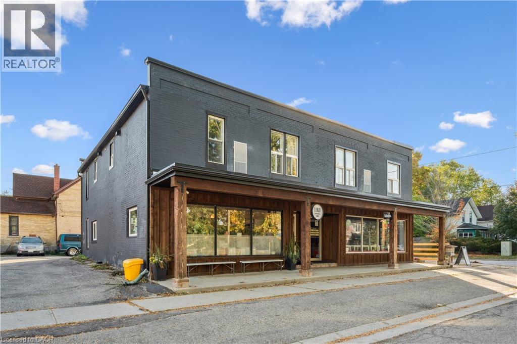 A building with a realtor logo in the corner.