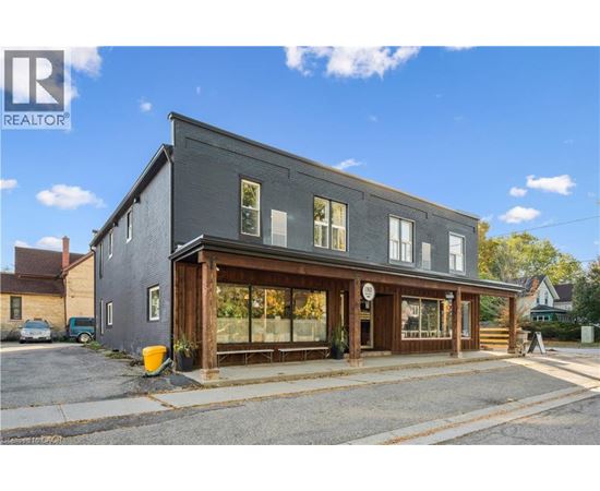 A building with a realtor logo in the corner.