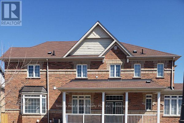 A house with a brown roof and a sign that says "REALTOR".