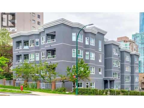 A grey building with a sign that says REALTOR.
