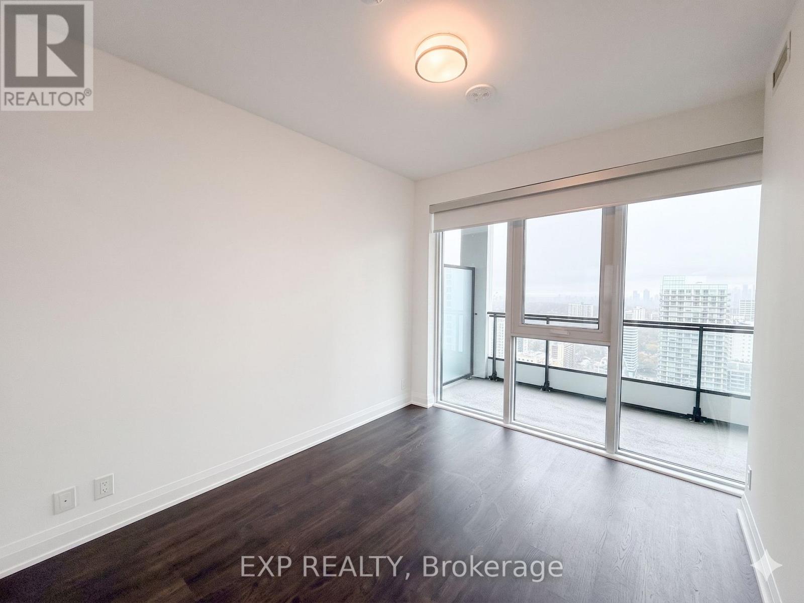 A room with EXP REALTY, Brokerage written on the floor.