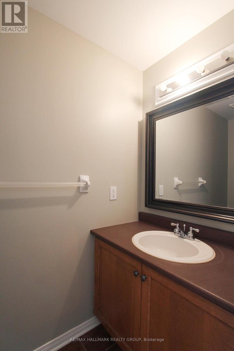 A bathroom with a sink and mirror.