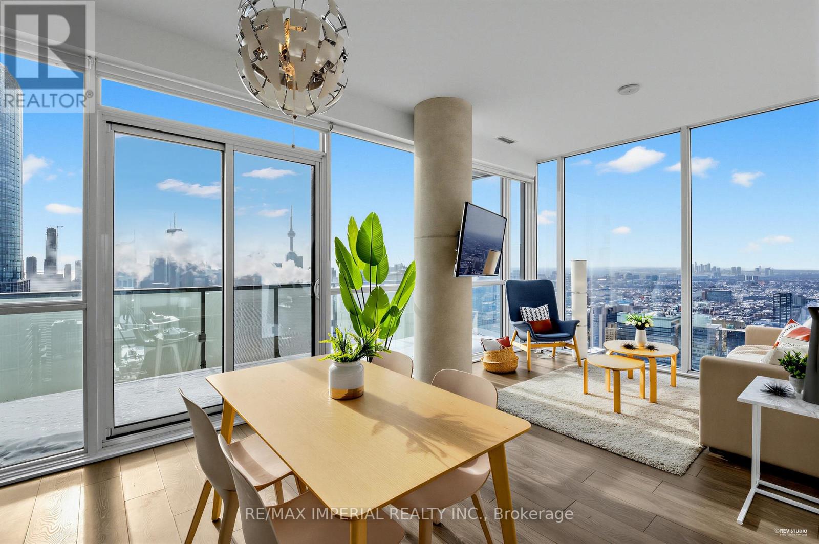 A modern living room with a view of the city skyline.