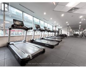 A gym with treadmills and exercise bikes.
