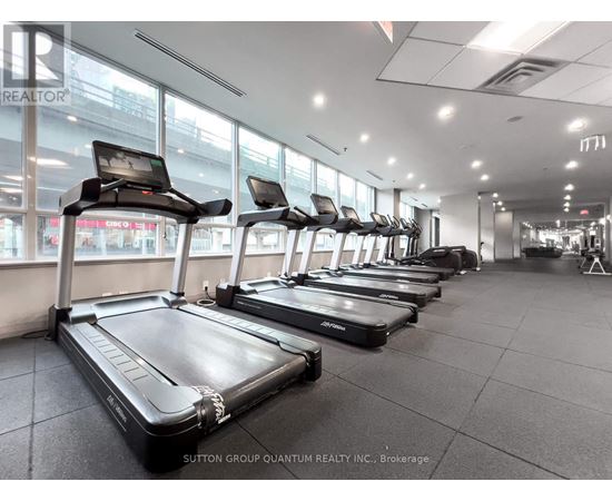 A gym with treadmills and exercise bikes.