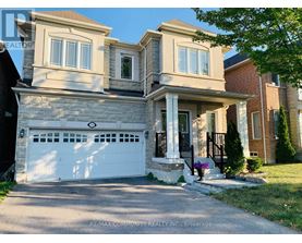 A two-story house with a white garage door is for sale.