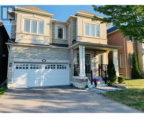A two-story house with a white garage door is for sale.