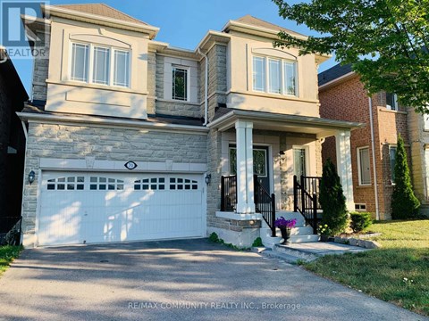 A two-story house with a white garage door is for sale.