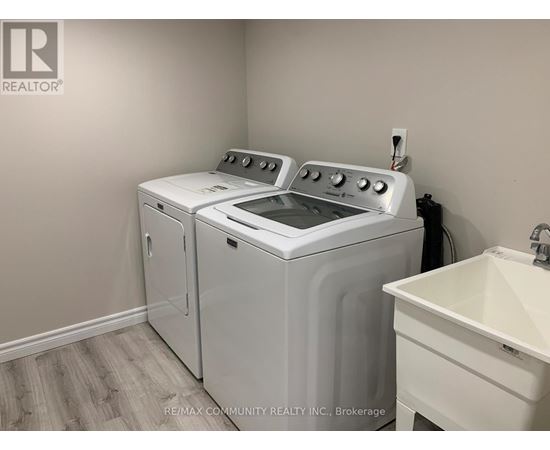 A white washer and dryer in a laundry room.
