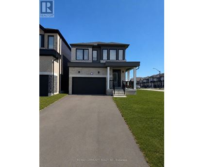 A modern two-story house with a garage is for sale.