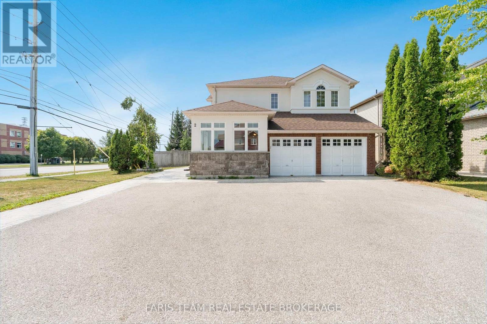 A large house with a garage is for sale.