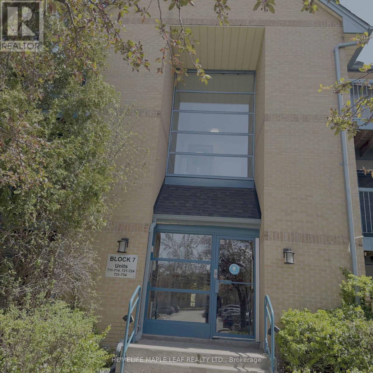 A building with a sign that says "BLOCK 7 UNITS 717-714" is shown.