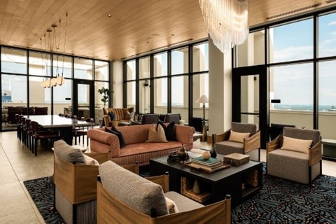 A large room with a lot of furniture and a chandelier.