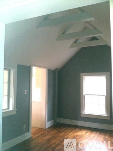 A room with a window and a door.