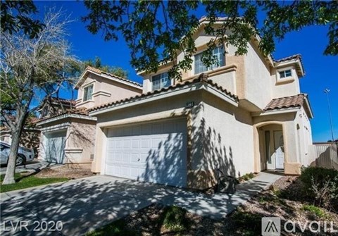 A house with a garage is for sale.