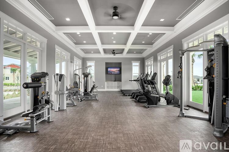 A spacious home gym with a variety of exercise equipment.