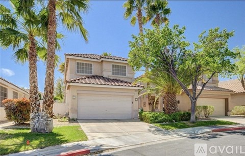 A house with a palm tree in front of it.