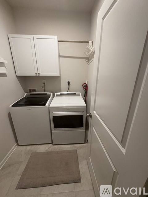 A small kitchen with a sink, stove and oven.