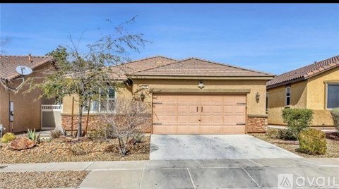 A house with a brown garage door is for sale.