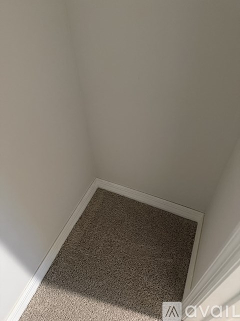 A carpeted stairway leading to a second floor.