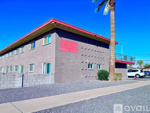 A building with a red roof and a sign that says "The Villa".