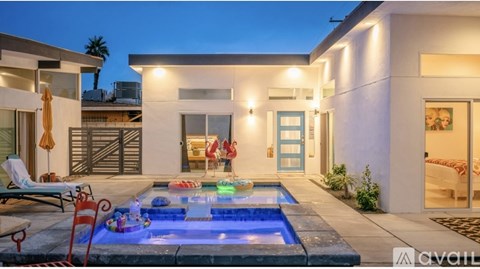 A modern house with a pool in the backyard.